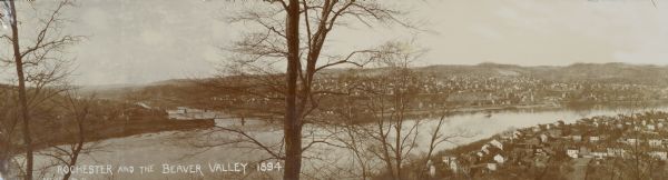 Panoramic view of Rochester and the Beaver Valley. Junction of the Beaver River and the Ohio River. Settlements and multiple bridges are in the background.