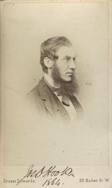 Carte-de-visite portrait of Joseph D. Hooker (1817-1911), English botanist, plant collector and traveller.  Son of Sir William Hooker.  A close friend of Charles Darwin, Hooke became the director of Kew Gardens in 1865.  Shown here in three-quarter profile.  Handwritten script at bottom of the image reads, "Jos. D. Hooke[r], 1864."
