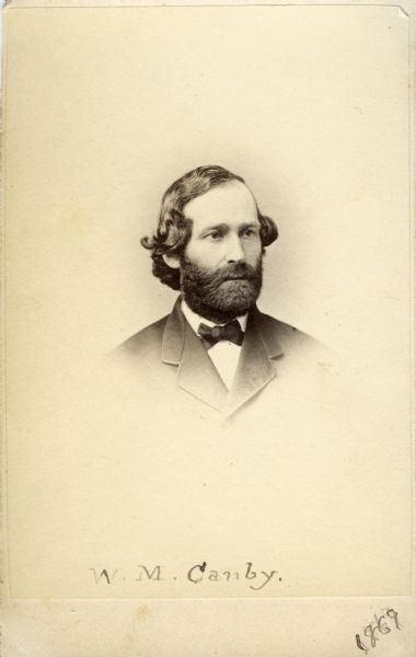 Vignetted carte-de-visite portrait of William Marriott Canby (1831-1904), American botanist and businessman. Canby involved himself in many diverse endeavors in and around Wilmington, Delaware, over the course of his career. Canby's specialized in insectivorous plants, such as the Venus flytrap--a topic on which he corresponded with Charles Darwin. Shown here in three-quarter profile, wearing a bow tie. A handwritten inscription at the bottom reads, "W.M. Canby, 1869."