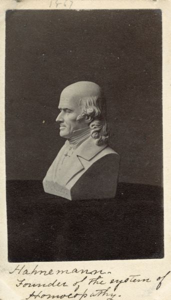 Carte-de-visite featuring a bust of Samuel C.F. Hahnemann (1755-1843), German physician. Hahnemann is credited as the founder of homeopathic medicine, as well as the practice of quarantining. Handwritten inscription on front reads, "1867 - Hahnemann, Founder of the system of Homeopathy."
