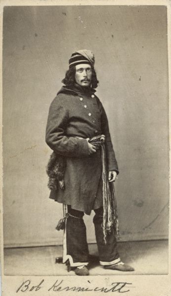Full-length carte-de-visite of Robert Kennicott (1835-1866), American Naturalist. After 1853 he worked for Spencer Fullerton Baird at the Smithsonian Institution in Washington, D.C., and was a prominent member of their Megatherium Club. In 1865, Kennicott worked for the the Western Union Telegraph Expedition, attempting to find a possible route for a telegraph from the United States to Russia. Shown here in costume, possibly from an expedition to northern Canada. Handwritten inscription at the bottom reads, "Bob Kennicott."