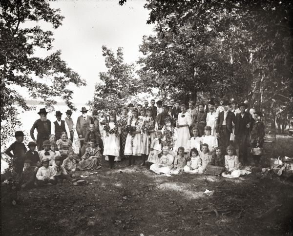 Large group of people at a picnic at Kratz Grove on the south shore of Buffalo Lake.