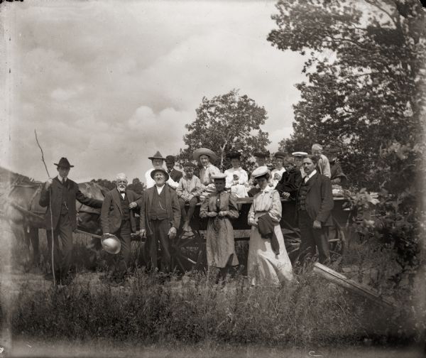 Kern family with other picnickers in a horse-drawn wagon.