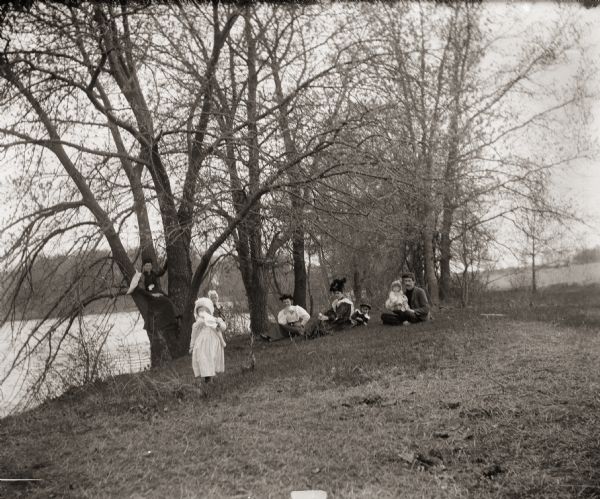 Ada Bass with friends on the shore of the Fox River.