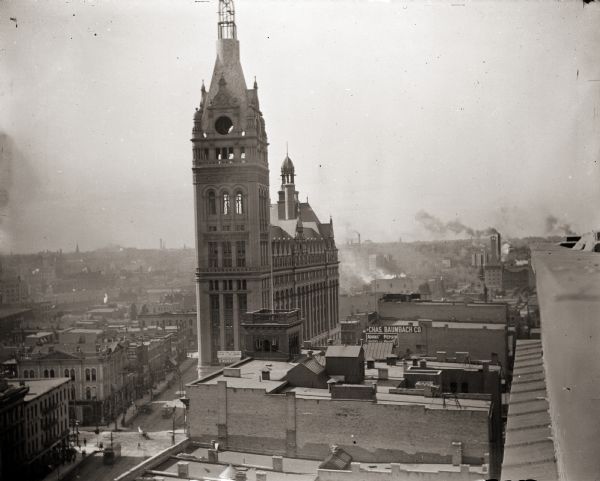 Elevated view from the top of a building of Milwaukee City Hall under construction.