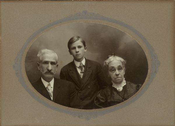 A studio portrait of Dr. Edward A. Bass with his son, Edward Cary Bass, and his mother, Lorinda Hill Bass.