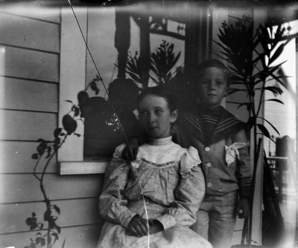 Edward Cary and Everetta Bass on the porch of their house at 207 Clay Street.