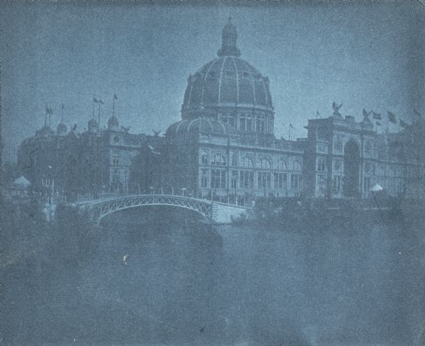 Cyanotype scenic view of the 1893 Chicago World's Columbian Exposition grounds showing the U.S. Government Building and a bridge over the lagoon.