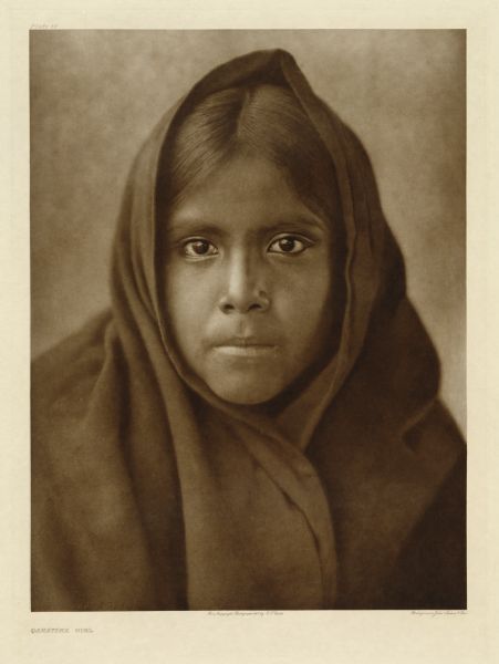 A head and shoulders portrait of a Qahatika girl.