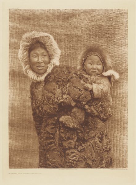 Portrait of a Nunivak woman and child.