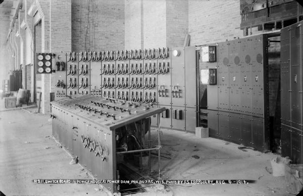 An interior view of the power house at the Prairie du Sac dam showing the switchboard.