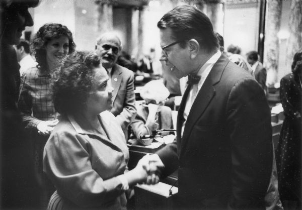 Paul Simon, a member of the Democratic Party from Illinois, talking with Marcia Coggs, the first African American woman elected to the Wisconsin Legislature.