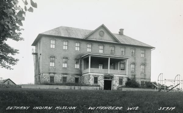 Exterior view of the Bethany Indian Mission School. Caption reads: "Bethany Indian Mission, Wittenberg, Wis."