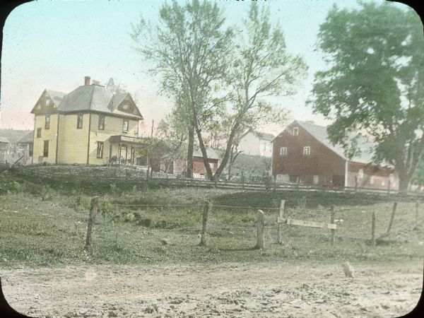 Hand-colored view of a farm taken from the road.
