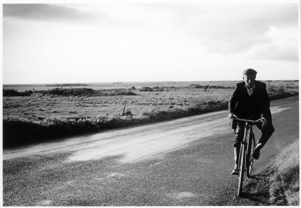 Man biking on the Headford Road in Galway County, Ireland.