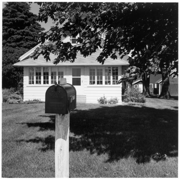 Mailbox and front porch of the Quinney farmhouse.