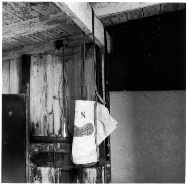 Horse feed bag hanging from the barn rafters on the Quinney farm.