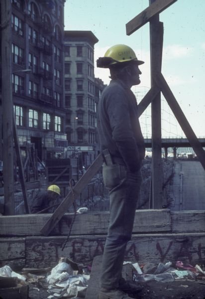 Construction worker standing at construction site of the World Trade Center.