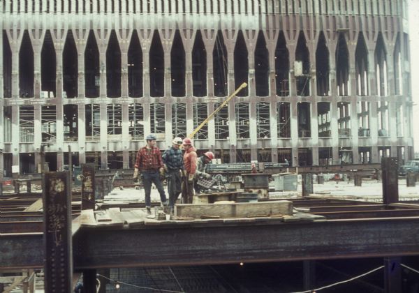 Construction workers on the World Trade Center steel framework.