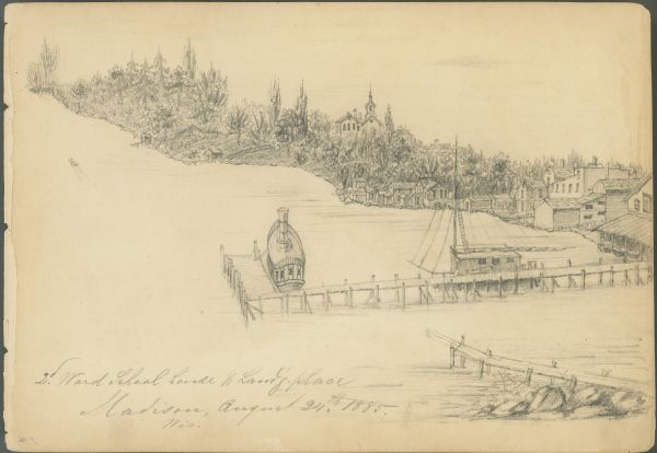Pencil on paper; promontory shoreline with houses, trees, and church in background sweeping to right, with long pier jutting into lake.  Two boats tied to pier, one seen from behind at right angle with smokestack and railings, the other along main pier, with mast and downed rigging.  Another pier stretches out from bottom right corner. Titled and dated beneath image, left hand corner.