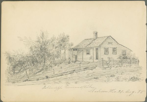 Pencil on paper; wood clapboard house behind fallen fence with open gate.  Three trees, small outbuilding with one-sided roof, a large tub and other equipment are strewn around yard with picket fence on far side.  House with added shed roof at back has one high window, three side windows, and one front window beside door.  Roof has ladder to chimney, and below, rain gutter across porch and spout to water barrel. The porch is walled at far end, with an empty chair at the other.  A loosely planked road runs along the fence. Title, illegible, below image. Dated, bottom right corner.
