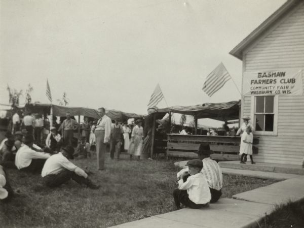 Community Fair of the Bashaw Valley Farmers Club.  E.L. Lutcher, head of the farmers institutes program of the agricultural extension, described the area as one of the most progressive communities in Wisconsin.