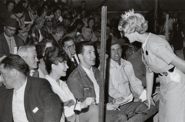 Alice in Dairyland, Sylvia Lee Kafkas, greeting admiring members of the public at the junior livestock exposition in Eau Claire. The Alice in Dairyland competition is not, strictly speaking, a beauty contest. Instead the winner, who is a state employee, is a spokesperson for Wisconsin's dairy industry.