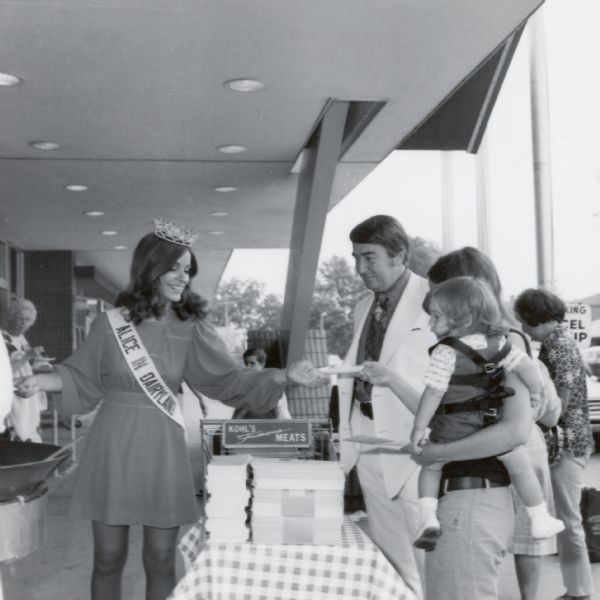 At a promotional event Deborah Moser, Alice in Dairyland, makes scrambled eggs for customers at a Kohl's grocery store.