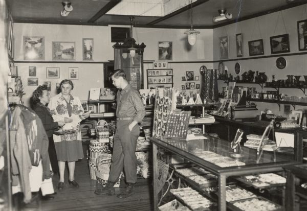 Gift shop at the Bennett Studio.  The pictured individuals include Ruth Bennett Dyer and Oliver Reese. In addition to operating the photography studio, the Bennett Studio gift shop was also the place where tourists could purchase high quality gifts and souvenirs.