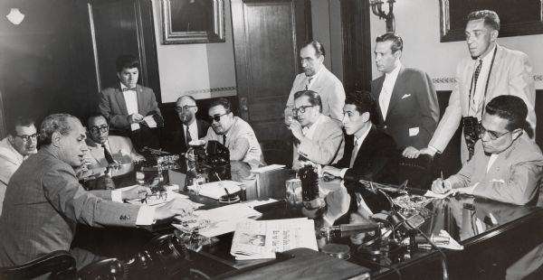 Governor Walter J. Kohler, Jr., meeting with a delegation of Latin American newspapermen in his office at the Wisconsin State Capitol.