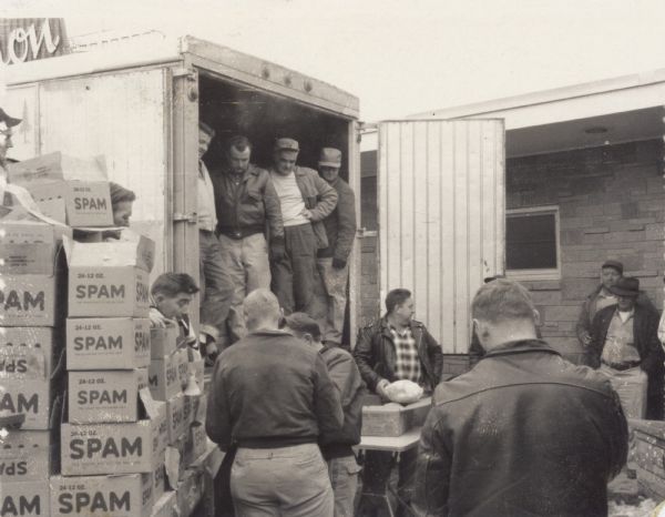 Distribution of holiday turkeys and spam to striking members of the UPWA union. The truck was sent by the local in neighboring Austin where Spam was produced.