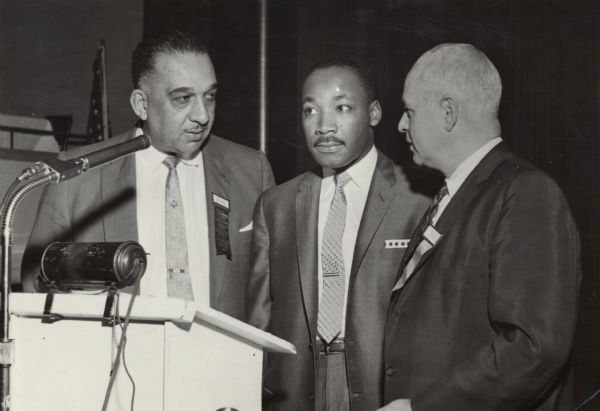 Martin Luther King, Jr., with two leaders of the United Packinghouse Workers of America, Russell Lasley, and President Ralph Helstein. Probably at a UPWA convention.