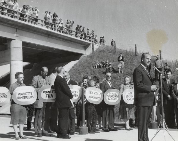 Governor Gaylord Nelson with local civic leaders at the dedication of a portion of Interstate Highway I-90. Congressman Robert Kastenmeier is standing at the right edge of the photograph.
