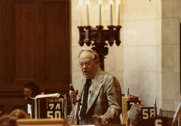 Informal portrait of Democratic Assemblyman Harvey Dueholm in the Wisconsin State Capitol.  A retired farmer, Dueholm was well-known for his humorous, down-to-earth wisdom.