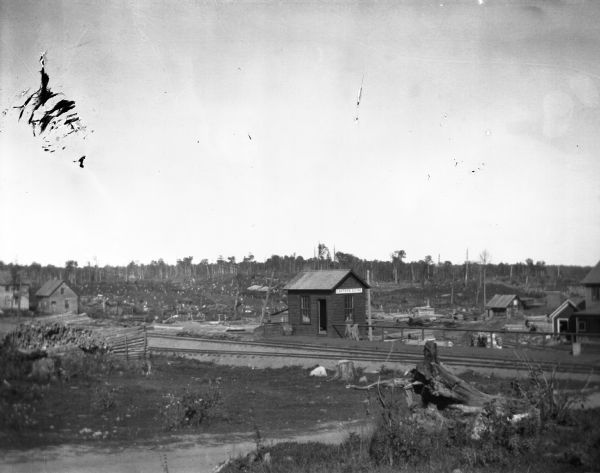 Carter's Siding, a small railroad depot in "cutover" country, showing strong evidence of why formerly forested regions of northern Wisconsin were so named.