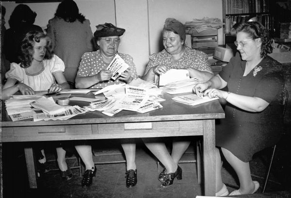 Members of the United Automobile Workers Auxilary #2 preparing literature for the political campaign of E.V. Bobrowicz. Bobrowicz, an officer of the Fur and Leather Workers Union (CIO), defeated incumbent Thaddeus Wasielewski in the Democratic primary. Wasielewski's subsequent decision to run as an Independent in the general election split the Democratic vote and Republican John Brophy was narrowly elected.