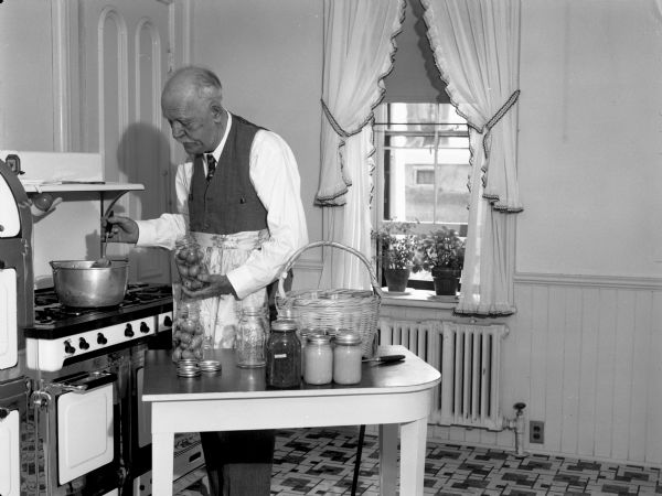 Governor Walter Goodland pickling pears.