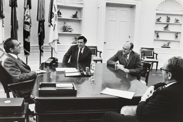 President Richard Nixon meeting with Secretary of the Navy John Chafee, Secretary of Defense Melvin Laird of Wisconsin, and Secretary of State Henry Kissinger in the Oval Office of the White House.