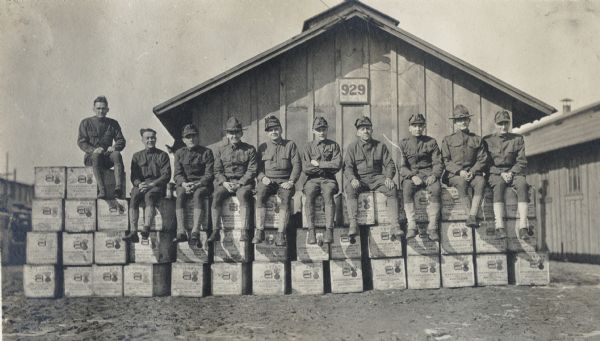 World War I soldiers at Camp Custer seated on Winchester rifle crates.