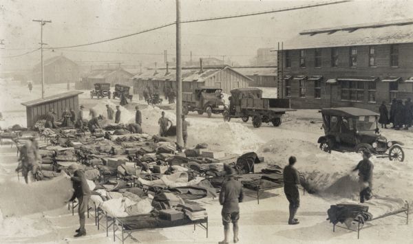 World War I soldiers airing out their bunks at Camp Curtis.