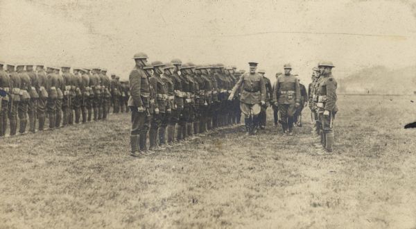 General Pershing inspecting troops in France. Victor Morris, in whose wartime album this photograph appears, may have been the photographer.  He identified the location as "A of O."
