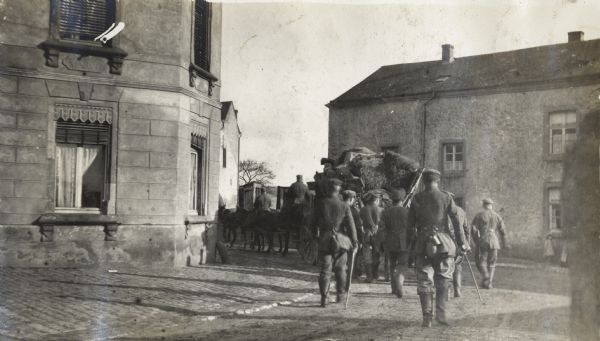 Victor Morris took this photograph of German troops leaving Ham, a French village on the Somme, nine days after the armistice. In accompanying notes, Morris indicated that he watched the Germans move past him for over an hour, "some of the officers scaring me with dirty looks." He learned later that he was in Ham in violation of the terms of the armistice.