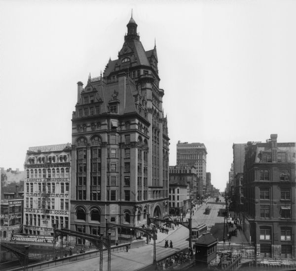 Elevated view from Wisconsin River looking east. The Pabst Building is on the northwest corner of N. Water Street and E. Wisconsin Avenue with the Mack building to the right. On the left is Espenhain's Department Store.