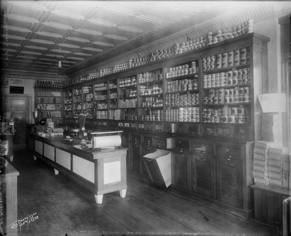The H.L Roehrborn Grocery Store, located at N. 41st and W. Burleigh Street. The interior of the grocery store contains canned goods and bins of food on display.