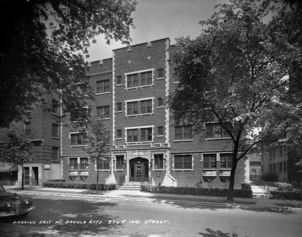 Caption on glass plate reads: "Looking east at Janola Apartments, 836 N 14th Street".