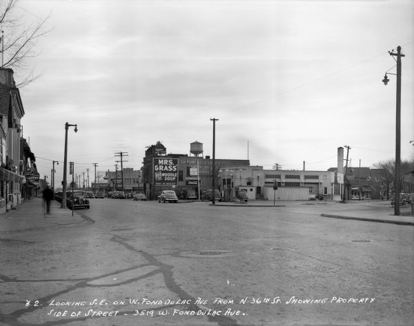 Looking southeast from N. 36th Street and W. Fond du Lac Avenue, Six Point beer garden and bottle house are visible on the right side of the street. Caption on the print reads, "Looking S.E. on W. Fond du Lac Ave. from N. 36th St. Showing property side of street-3519 W. Fond du Lac Ave".