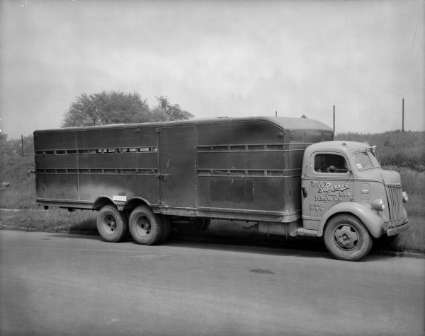 E.H. Barnes truck parked on road.
