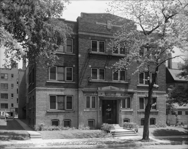 Front view of apartment building located at 920 N. 15th Street. Caption on the negative reads, "Looking East at 920 N. 15th Street."
