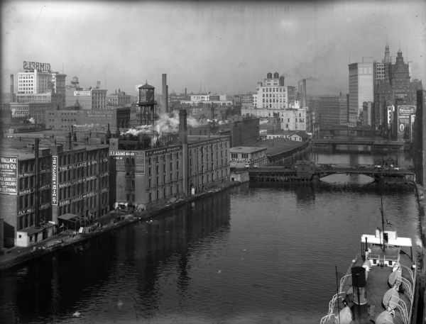 Looking north on the Milwaukee River from approximately E. St. Paul Avenue (Clybourn Street bridge in the foreground). This features an elevated view of the manufacturing district surrounding the Milwaukee River.