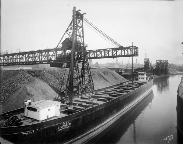 The Gilchrist Transportation Company cargo ship "Tyrone" transports coal on the Menominee River.